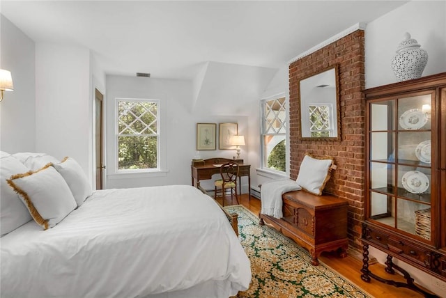 bedroom with hardwood / wood-style floors