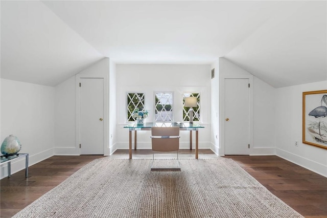 bonus room with dark hardwood / wood-style floors and lofted ceiling