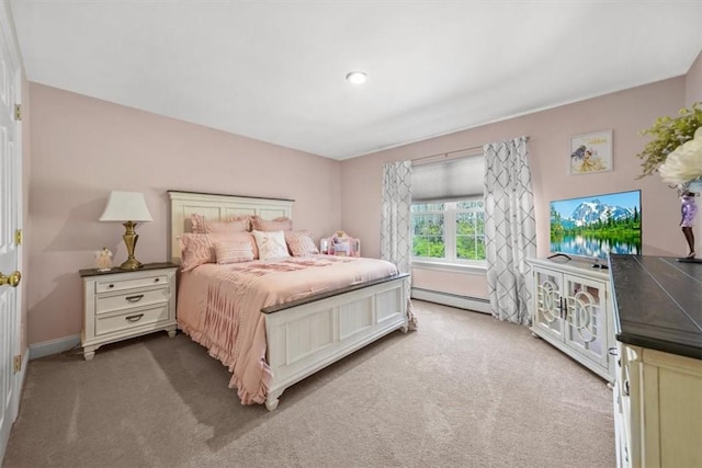 carpeted bedroom with a baseboard heating unit