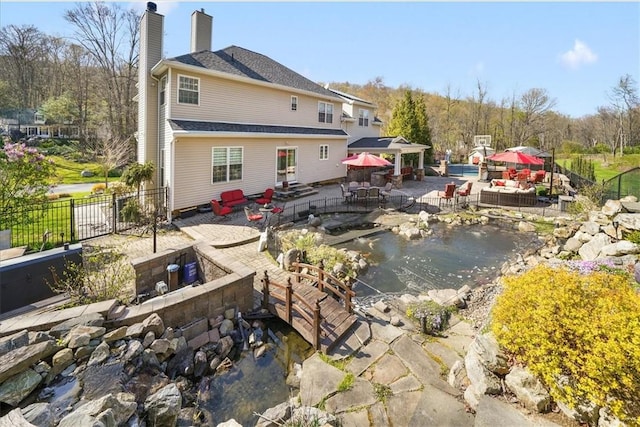 back of house with a patio