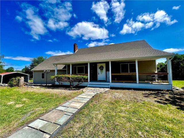 view of front facade with covered porch and a front lawn