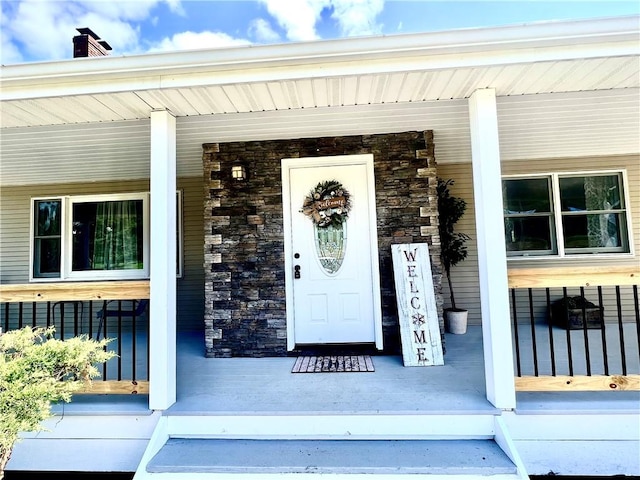 entrance to property with a porch