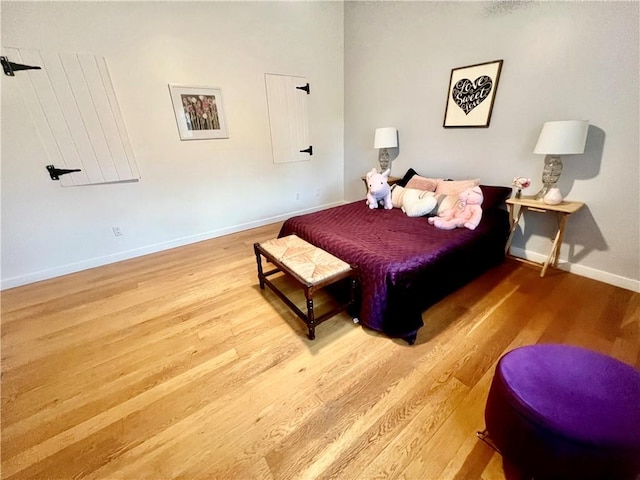 bedroom with hardwood / wood-style flooring