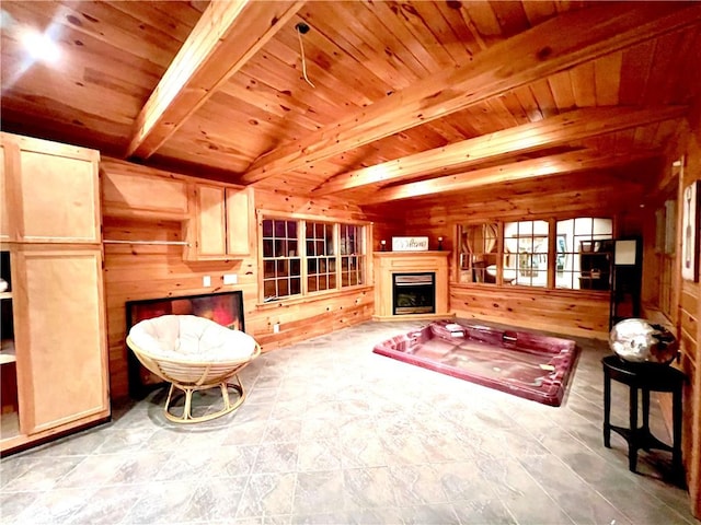 living room with beamed ceiling, wooden ceiling, and wood walls