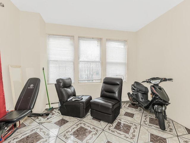 living area with baseboard heating and light tile patterned floors