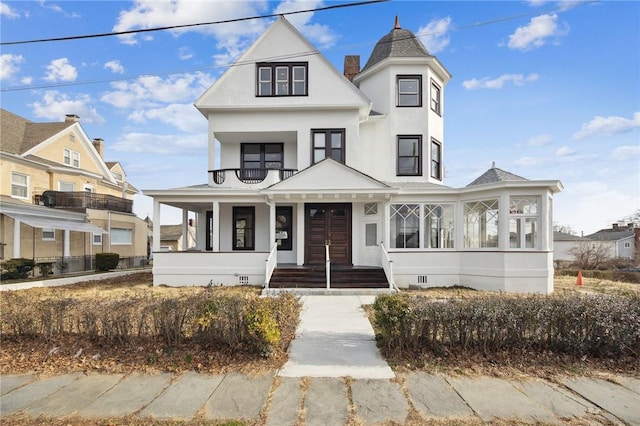 101 Summit Ave, Mount Vernon, NY 10550 - view of front facade with a balcony, covered porch, stucco siding, and crawl space