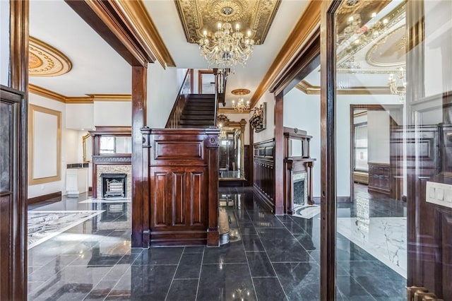101 Summit Ave, Mount Vernon, NY 10550 - corridor featuring ornamental molding, a chandelier, dark marble finish floors, and stairs