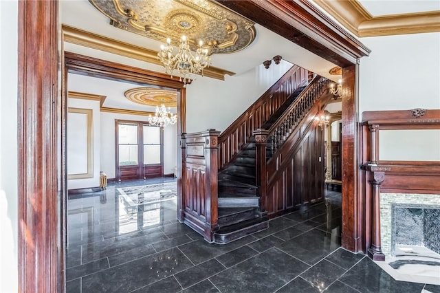 101 Summit Ave, Mount Vernon, NY 10550 - stairway featuring a chandelier, crown molding, a tray ceiling, and a premium fireplace