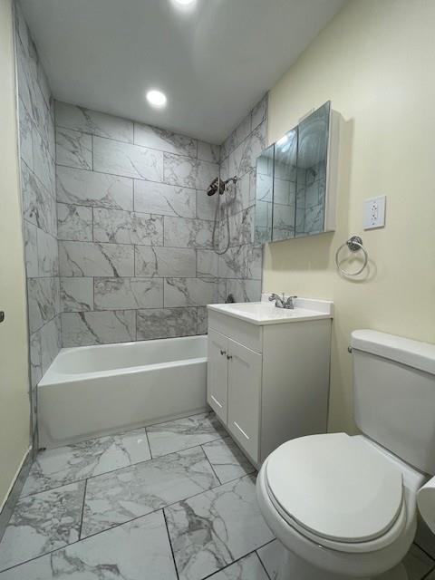 30 S Cole Ave Unit 3E, Spring Valley, NY 10977 - bathroom with toilet, marble look tile flooring, vanity, recessed lighting, and shower / bathtub combination