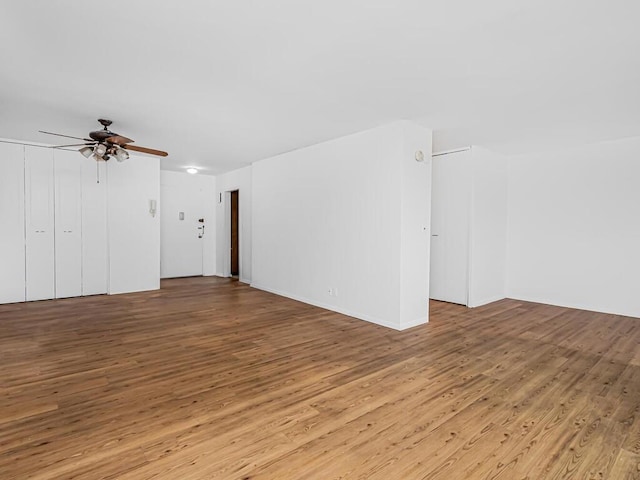 unfurnished room with ceiling fan and light hardwood / wood-style floors