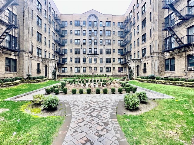 view of home's community featuring a lawn