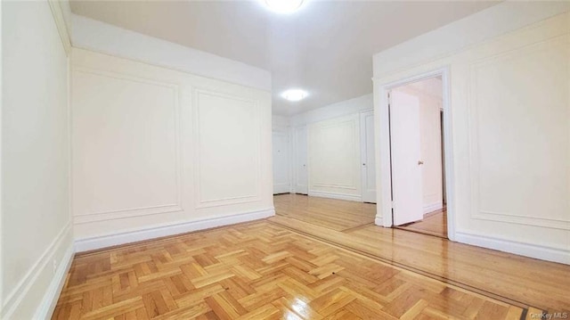 spare room with parquet flooring