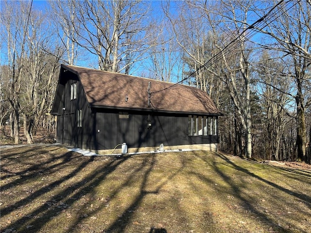 view of side of property with a yard