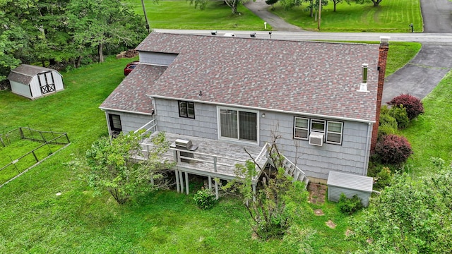 138 Reinhardt Rd, Middletown, NY 10940 - back of house with a shed, a shingled roof, a wooden deck, and a chimney