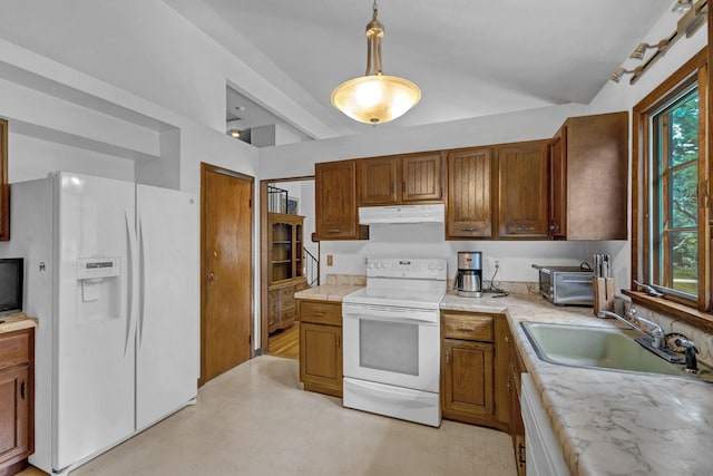 138 Reinhardt Rd, Middletown, NY 10940 - kitchen with white appliances, under cabinet range hood, healthy amount of natural light, and light countertops