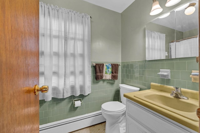 138 Reinhardt Rd, Middletown, NY 10940 - bathroom featuring a baseboard heating unit, tile walls, vanity, tile patterned flooring, and wainscoting