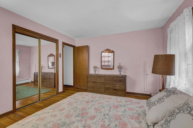 138 Reinhardt Rd, Middletown, NY 10940 - bedroom with a baseboard radiator, wood finished floors, and a closet