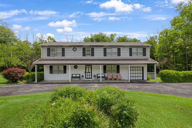 138 Reinhardt Rd, Middletown, NY 10940 - view of front facade with a porch, asphalt driveway, and a front lawn