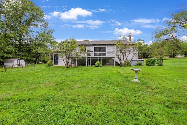 138 Reinhardt Rd, Middletown, NY 10940 - back of house with stairway, a storage unit, a lawn, and a deck