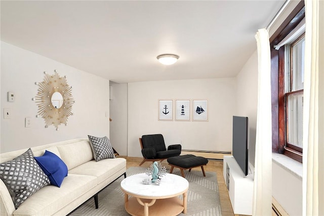 living room with baseboard heating and light tile patterned flooring