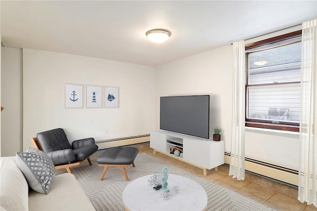 living room featuring light tile patterned floors, a wealth of natural light, and a baseboard radiator