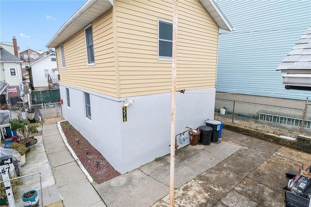 view of side of home with a patio