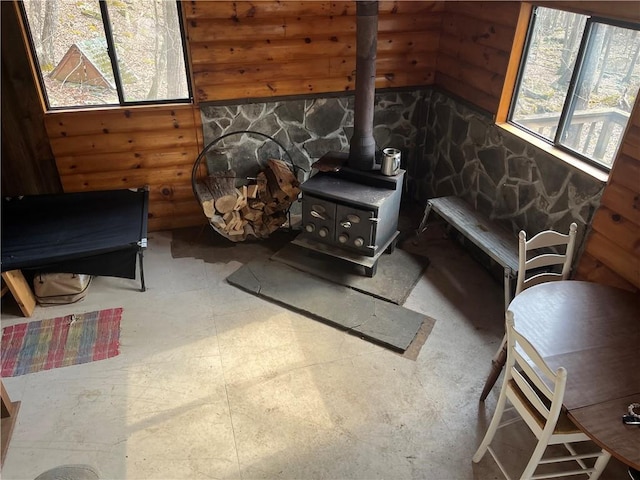 living area with a wood stove and plenty of natural light