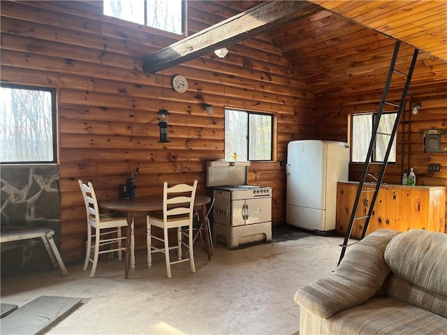 dining area with high vaulted ceiling and wooden ceiling