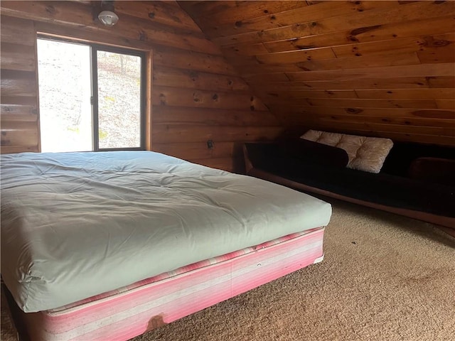 bedroom with carpet flooring, wooden walls, and vaulted ceiling