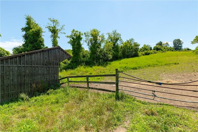 view of gate featuring an outdoor structure