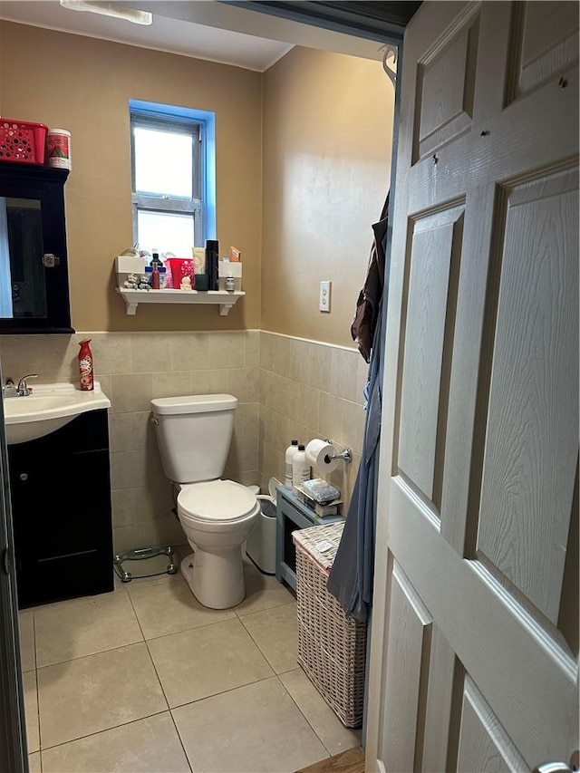 bathroom with tile walls