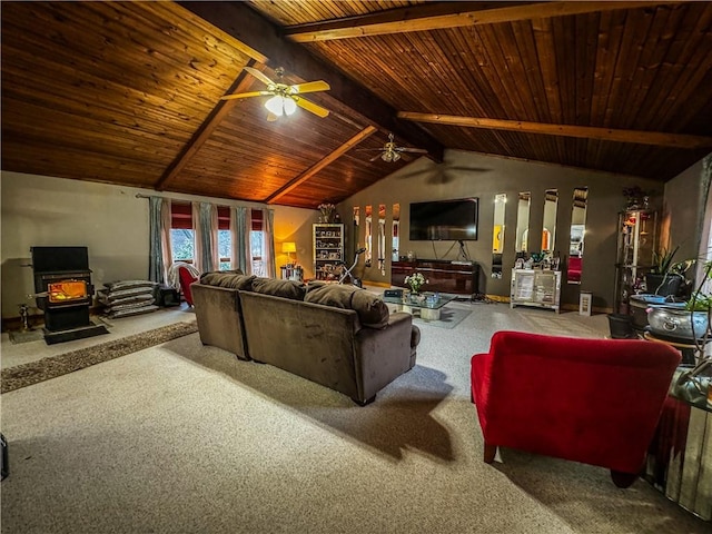 carpeted living room with lofted ceiling with beams, a wood stove, ceiling fan, and wooden ceiling