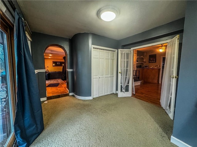 unfurnished bedroom with carpet floors and a closet