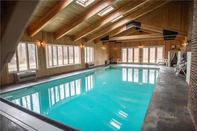 view of swimming pool featuring a skylight