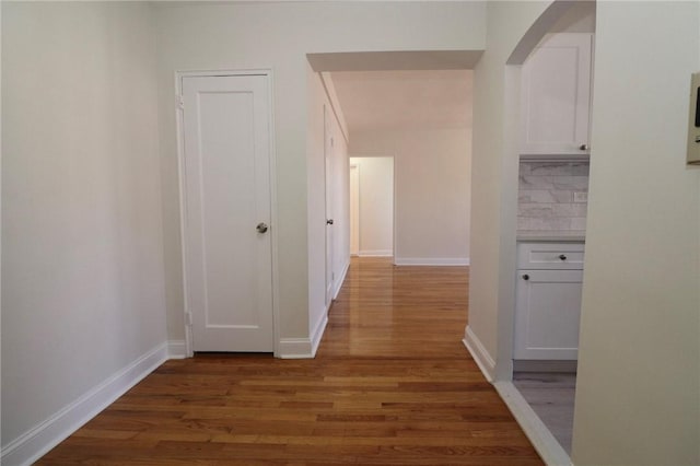 5645 Netherland Ave Unit 6A, Bronx, NY 10471 - corridor with wood finished floors, baseboards, and arched walkways