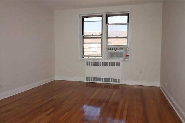 5645 Netherland Ave Unit 6A, Bronx, NY 10471 - unfurnished room featuring radiator, wood finished floors, baseboards, and cooling unit