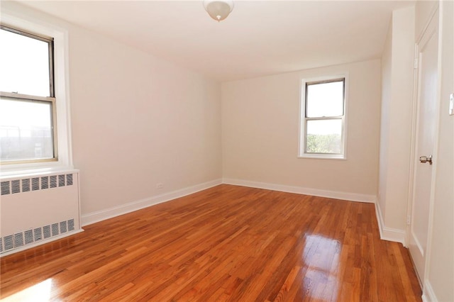 5645 Netherland Ave Unit 6A, Bronx, NY 10471 - empty room with radiator, light wood-style flooring, and baseboards