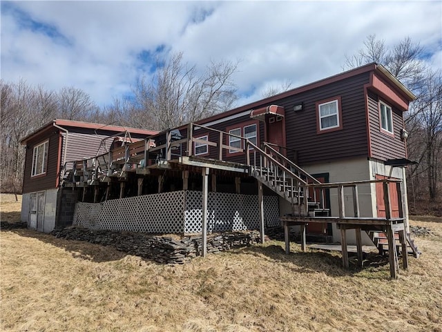 back of property featuring a deck