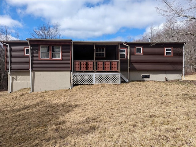 back of property with a porch