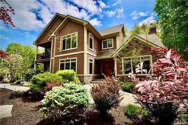 view of front of home featuring a balcony