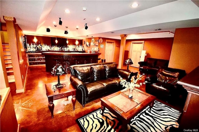 carpeted living room featuring indoor bar