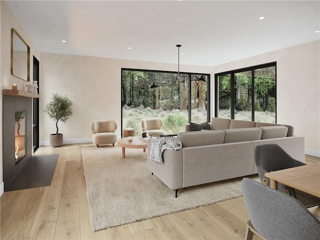 living room featuring a chandelier and light hardwood / wood-style floors