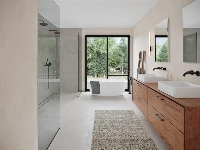 bathroom with tile patterned floors, vanity, and plus walk in shower