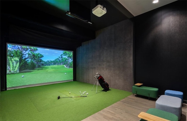 game room featuring wood-type flooring and golf simulator