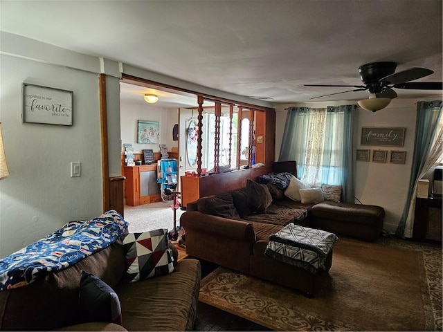 living room with ceiling fan and carpet floors