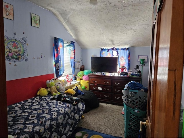 bedroom featuring carpet flooring, lofted ceiling, and a textured ceiling