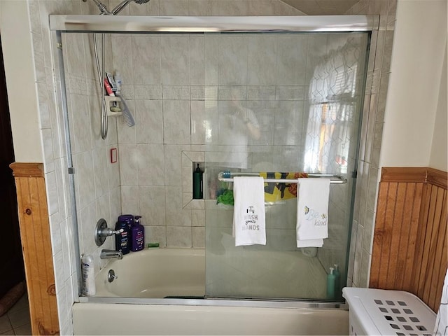 bathroom with shower / bath combination with glass door