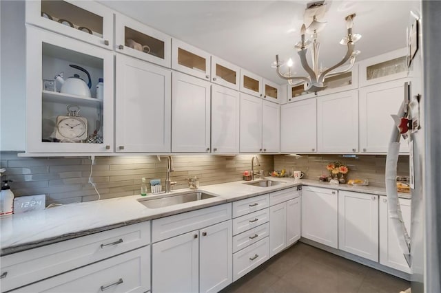 kitchen with white cabinetry and sink