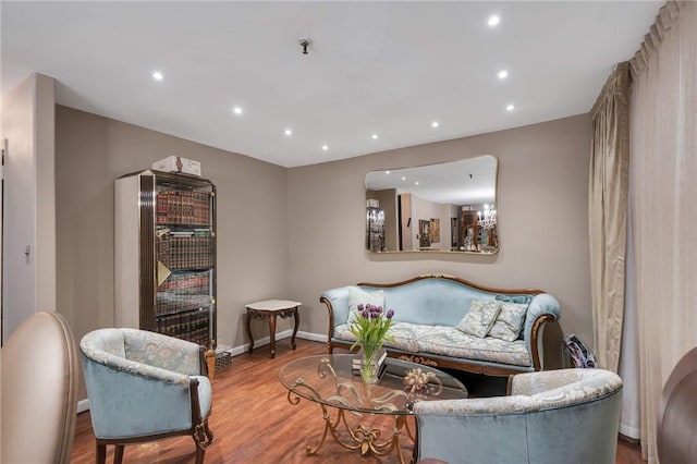 living area with hardwood / wood-style flooring