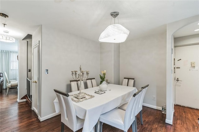 dining area featuring dark hardwood / wood-style floors